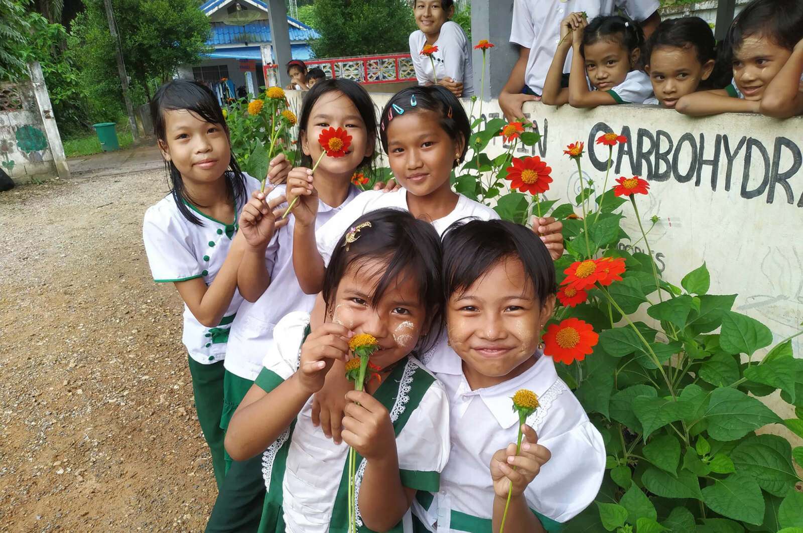 Children playing at a sponsored school