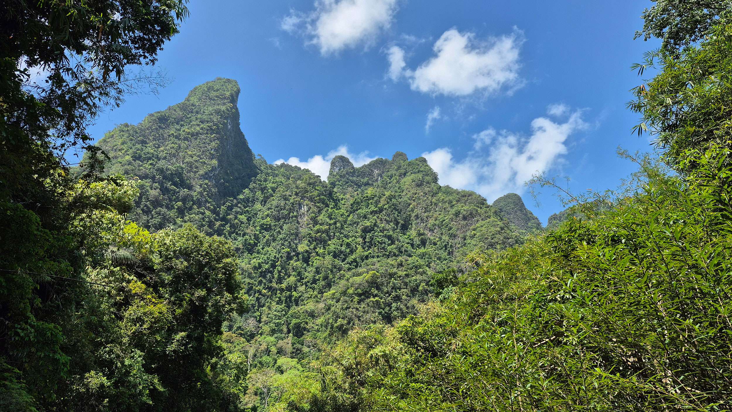 A picture of Karst mountains in khlong Phanom national park, Khao Sok with beautiful blue sky above